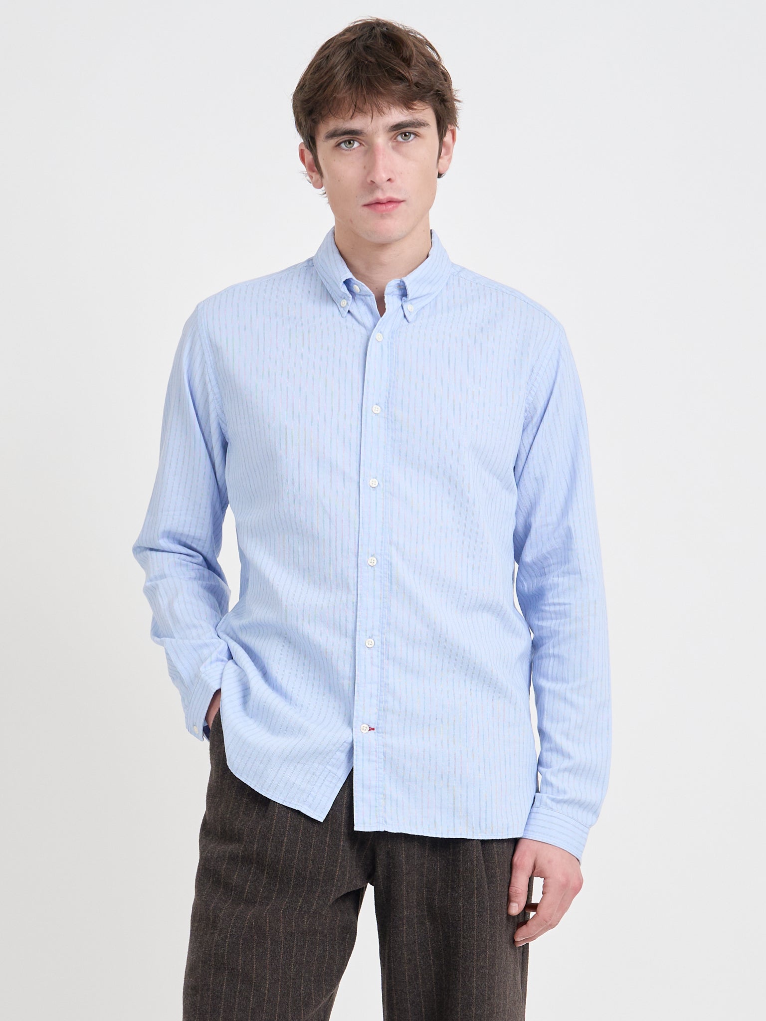 Close up shot of model wearing Oliver Spencer Men's Pale Blue Pinstripe Organic Cotton Button-Down Shirt