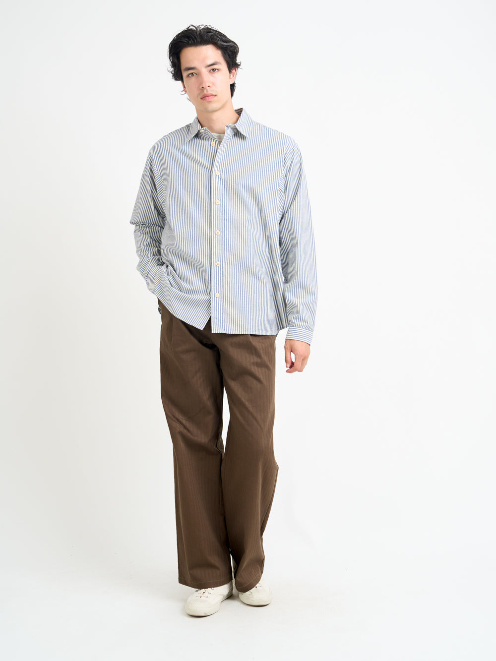 Model wearing Men's Oliver Spencer Blue and White striped Oversized Spread Collar Organic Cotton Shirt