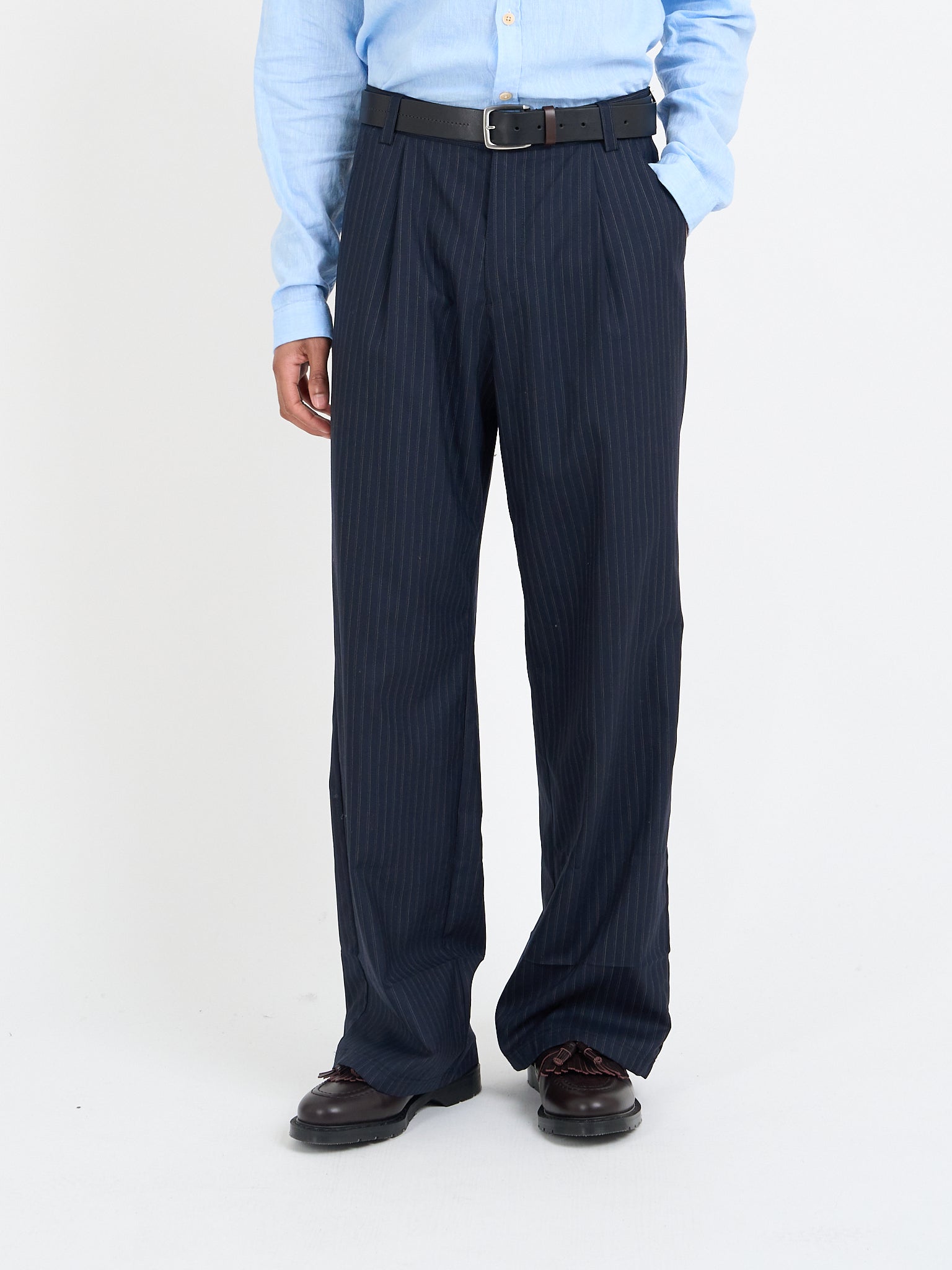 Orsman navy pinstripe wool trousers showing rear welt and patch pocket detail