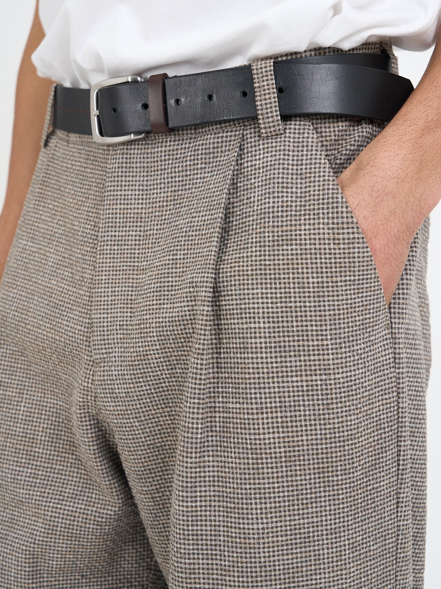 Single pleat and waistband detail on Hilliard brown Orsman trousers