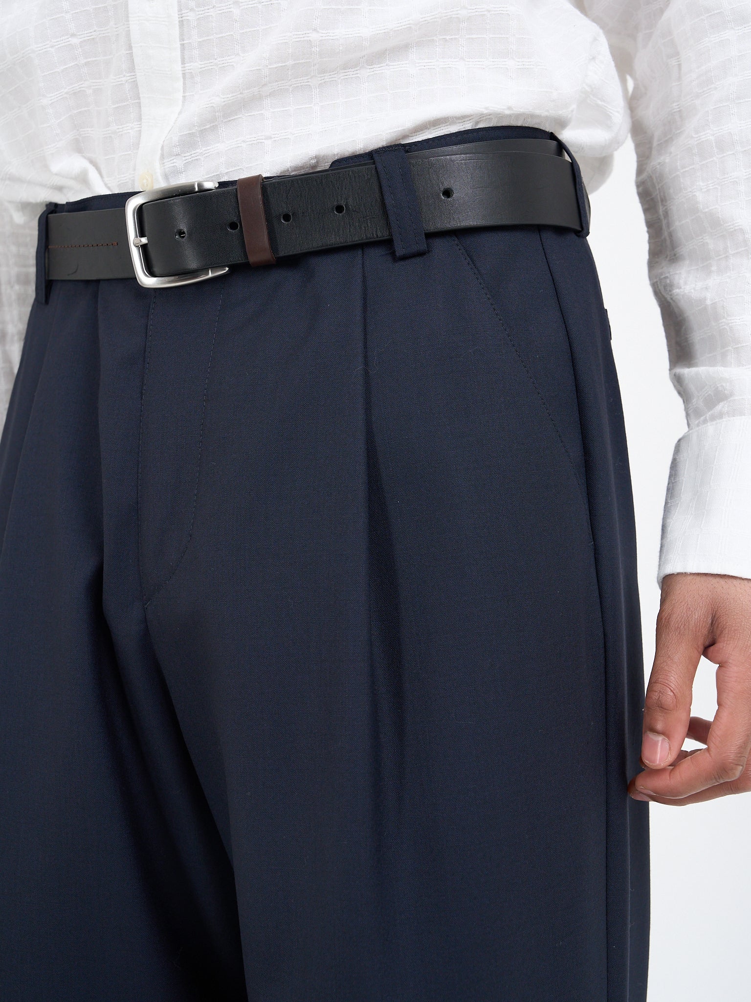 Detail of single front pleats on Orsman Miro navy trousers