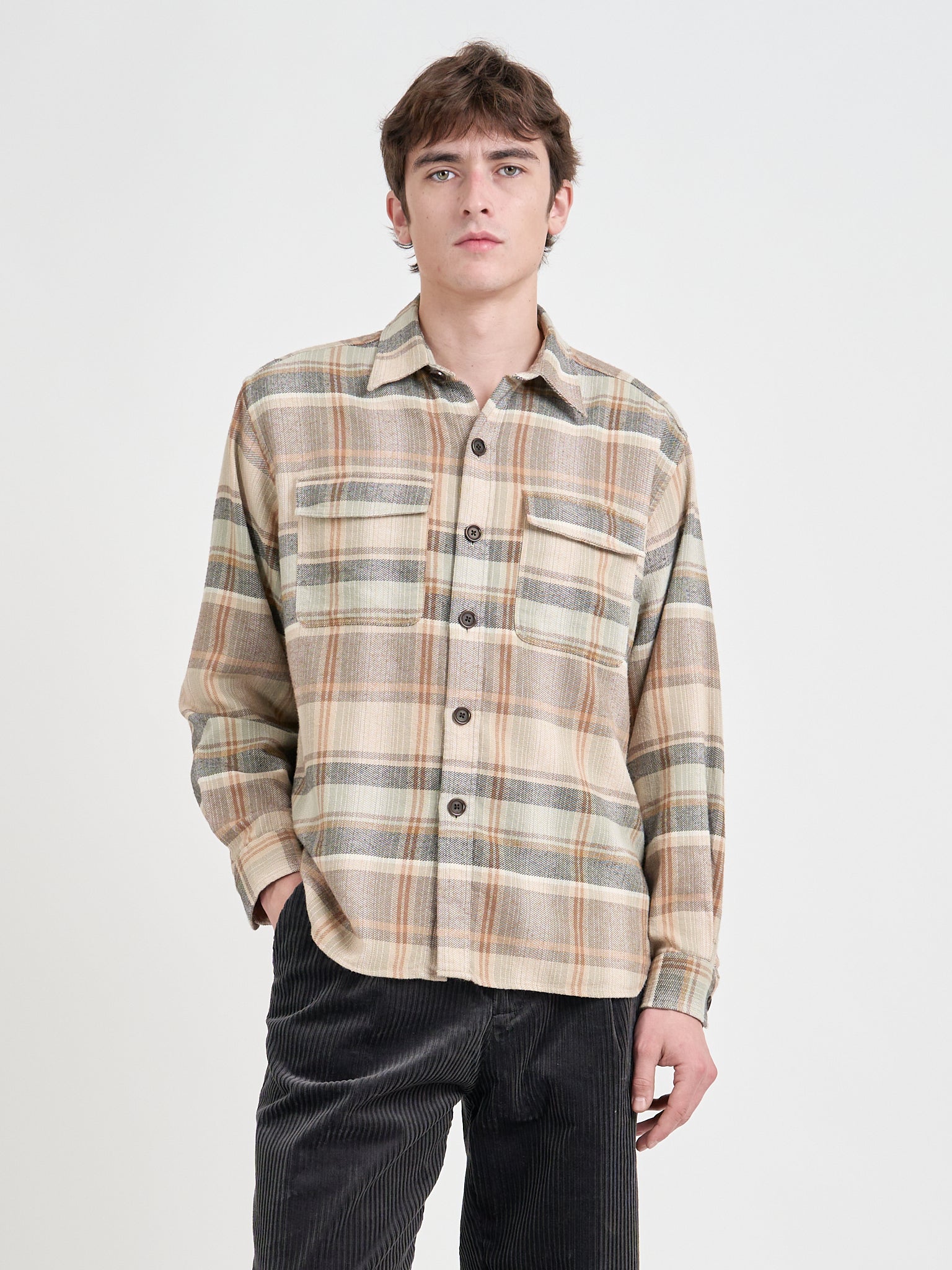 Close up shot of model wearing an Oliver Spencer Men's Beige Brushed Cotton Check Overshirt