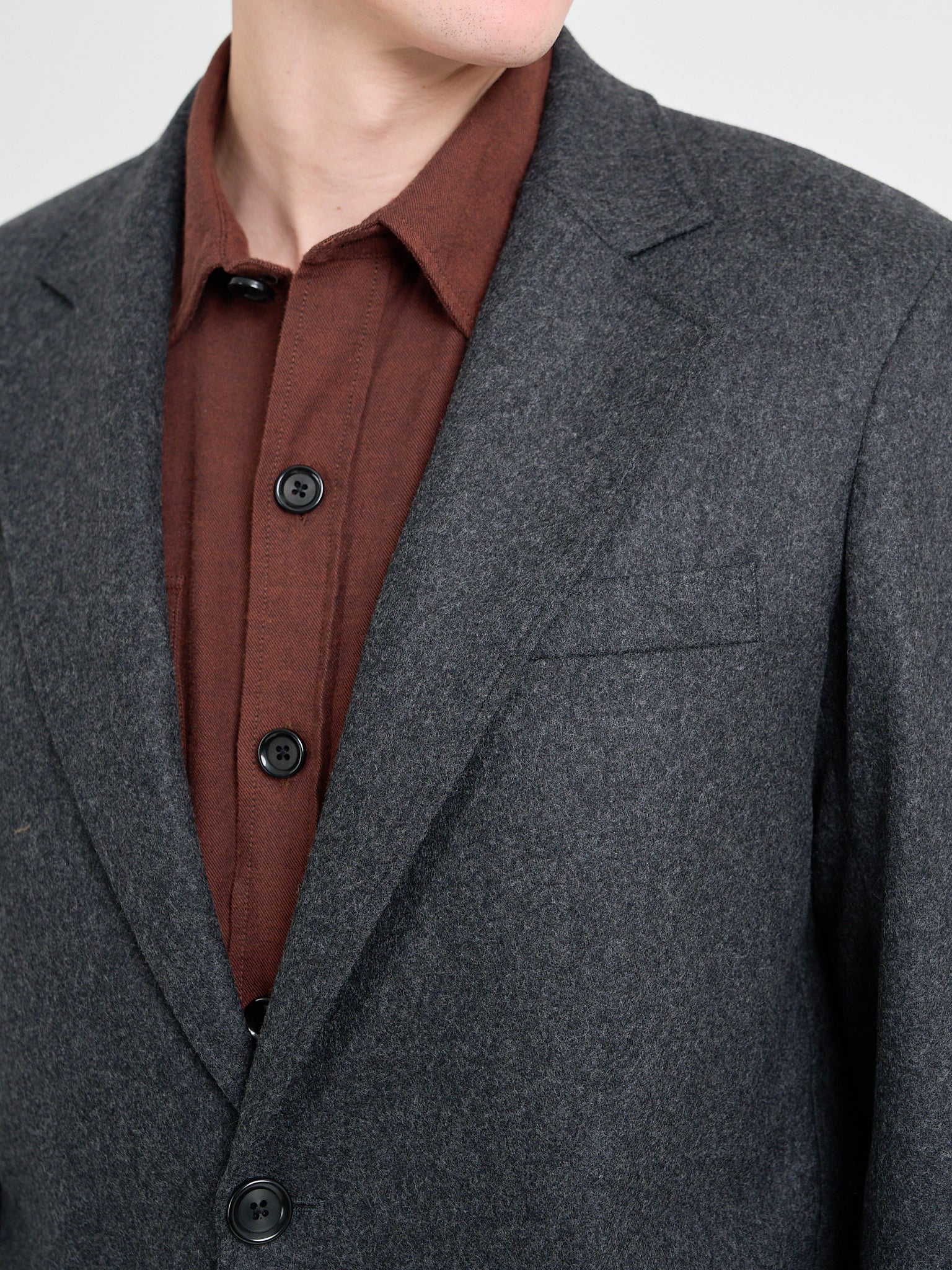 Detailed collar shot of model wearing Oliver Spencer Men's Charcoal Grey Wool Single-Breasted Jacket 