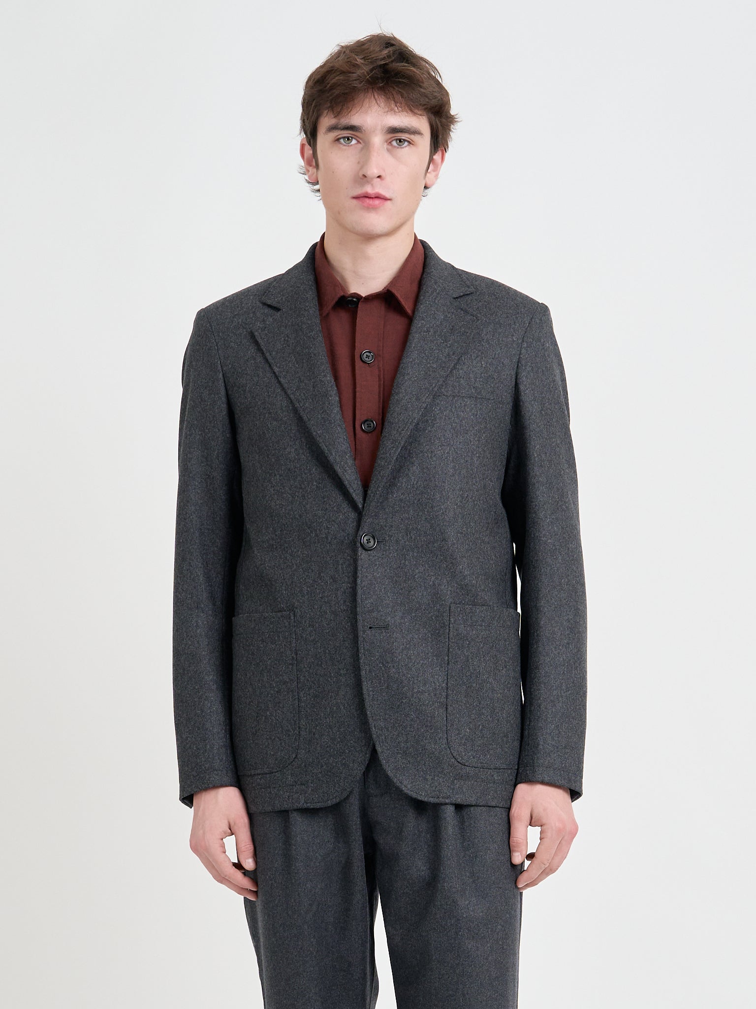 Close up shot of model wearing Oliver Spencer Men's Charcoal Grey Wool Single-Breasted Jacket 