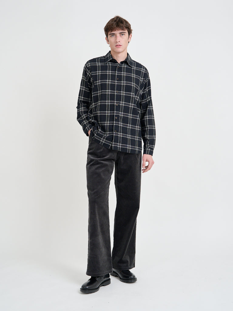 Video of Model wearing Oliver Spencer Men's Black Organic Cotton Check Overshirt